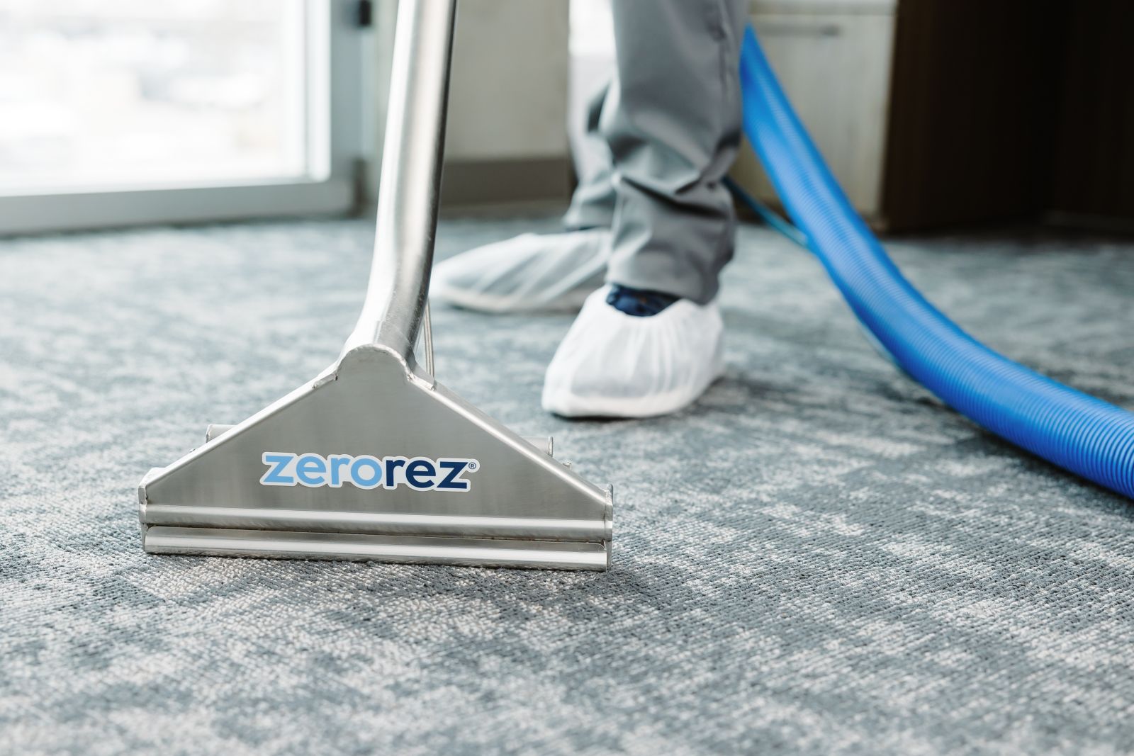 Zerorez&reg; Zr Wand extracting and cleaning Berber carpets in a commercial office building