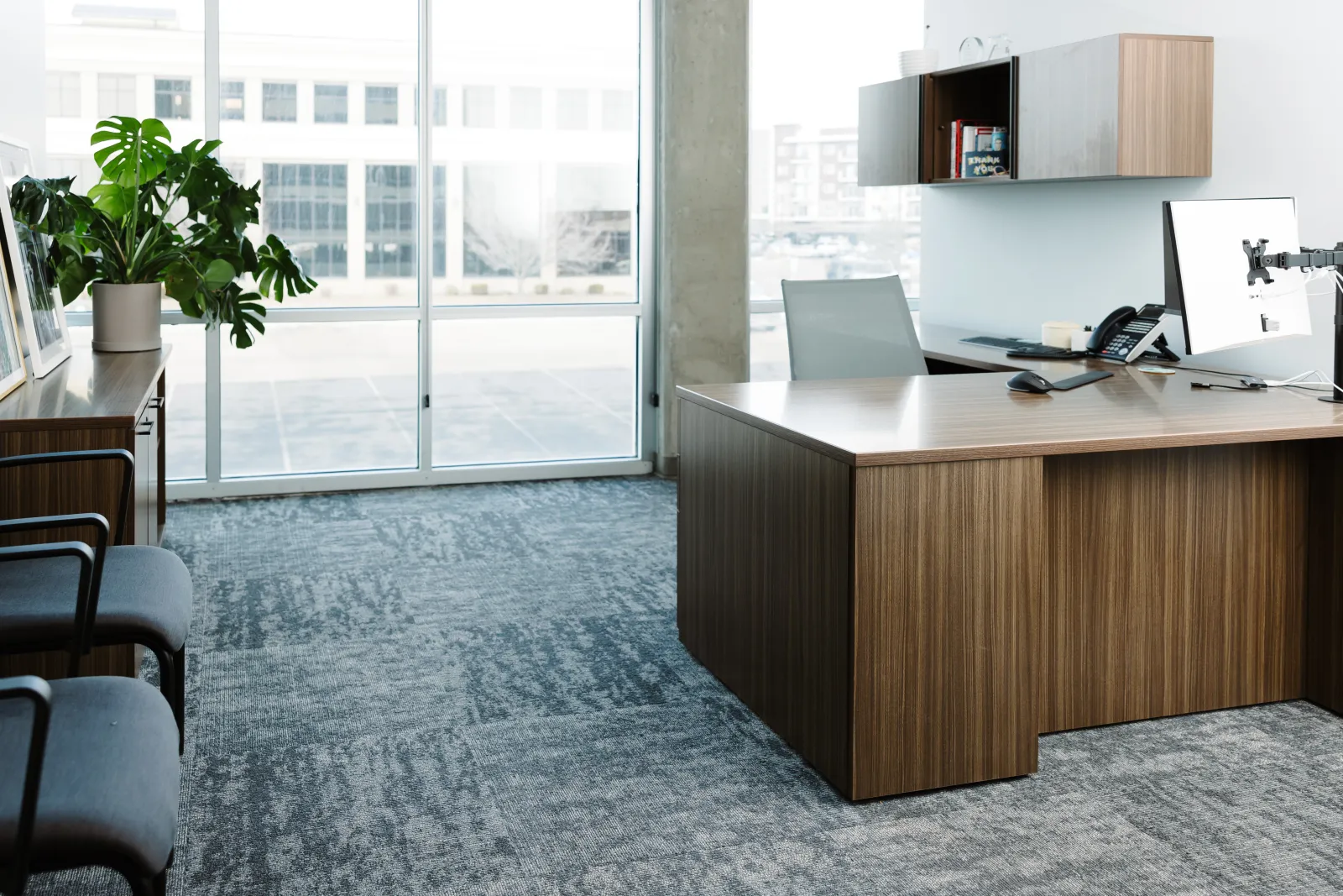 office with carpet and wood desk with chair